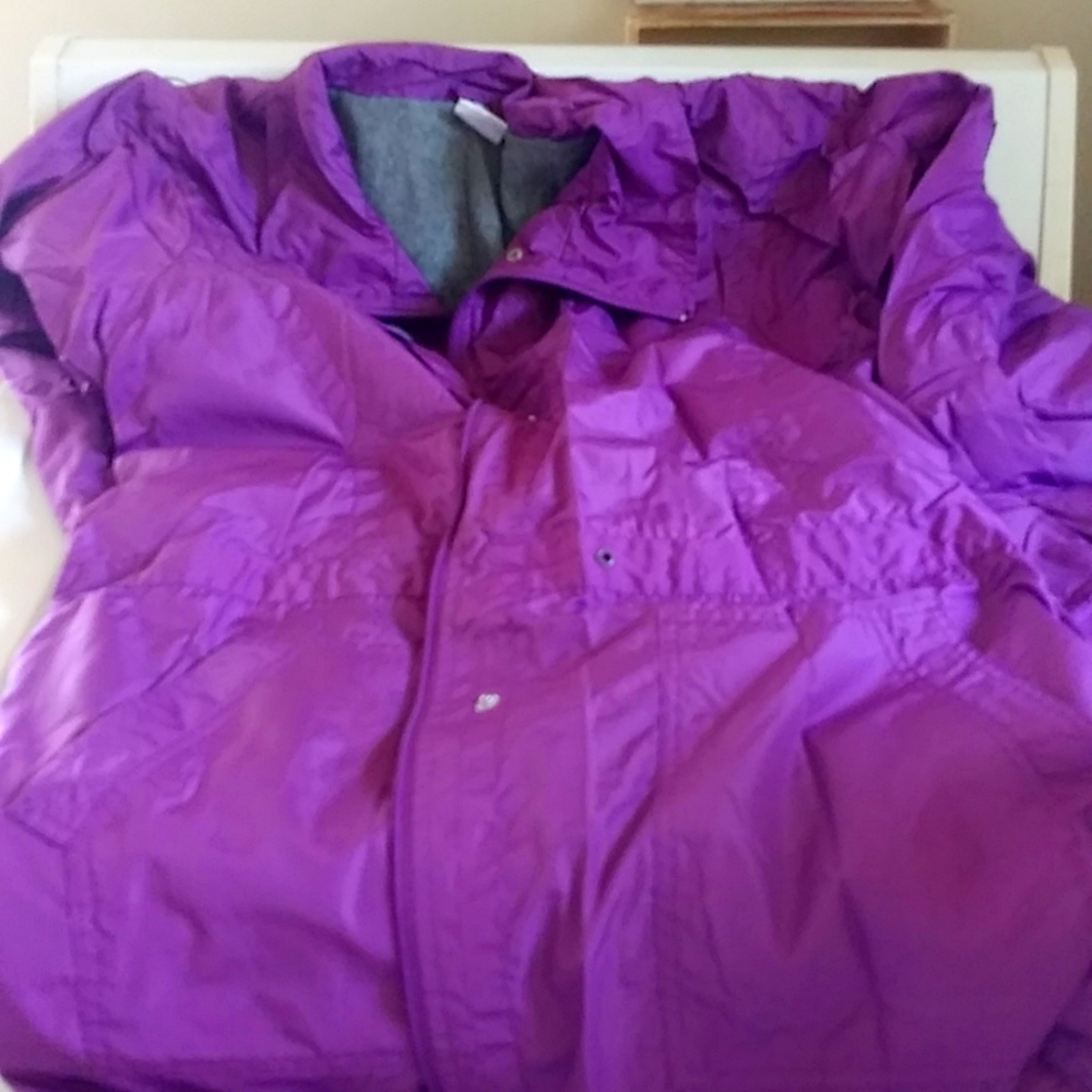 Purple coat with gray lining. Zip up with snaps.